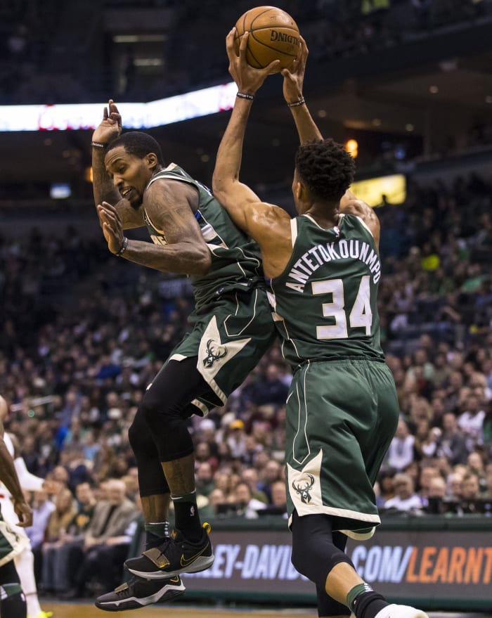 Milwaukee Bucks forward Giannis Antetokounmpo (34) grabs a rebound above guard Brandon Jennings (11)